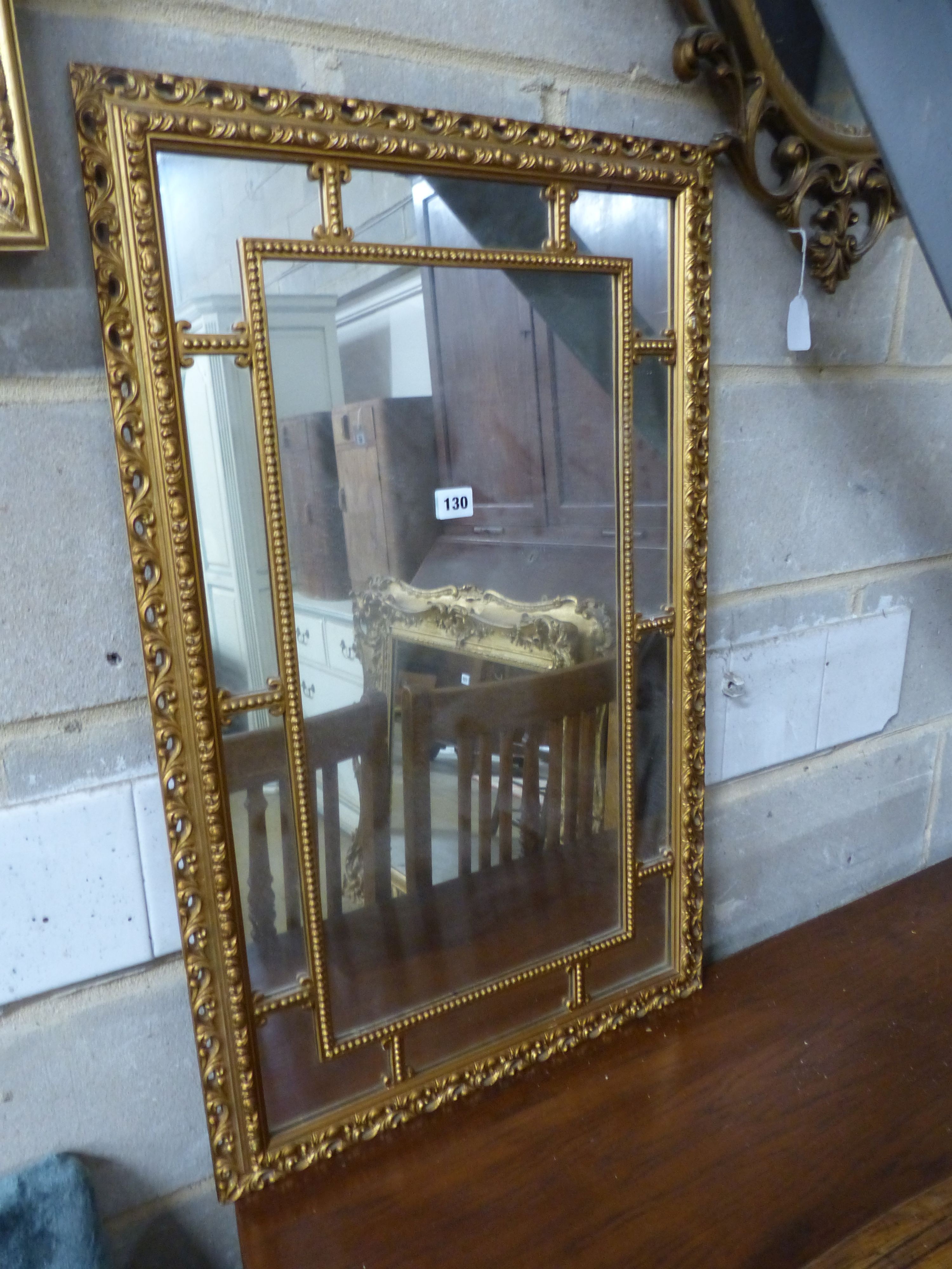 Three reproduction gilt framed wall mirrors, largest W.63cm H.85cm